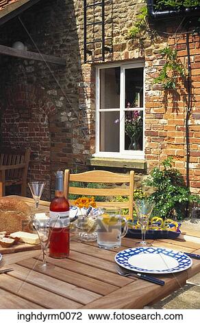 View of a meal laid on a dining table in a garden View Large Photo Image Stock Image - View of a meal laid on a dining table in a garden. Fotosearch