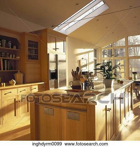 View of a modern wooden kitchen with a skylight View Large Photo Image Stock Photo - View of a modern wooden kitchen with a skylight. Fotosearch