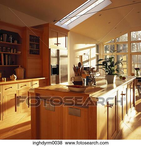 View of a wooden island counter in the center of a kitchen View Large Photo Image Stock Photo - View of a wooden island counter in the center of a kitchen. Fotosearch
