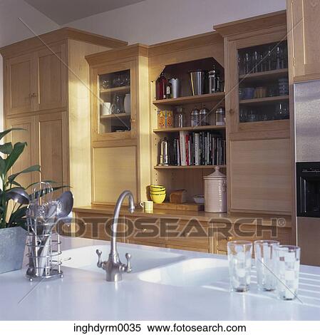 View of country style cabinets in a kitchen View Large Photo Image Stock Photography - View of country style cabinets in a kitchen. Fotosearch