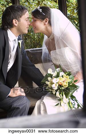 A newly married couple rubbing noses View Large Photo Image Stock Image - A newly married couple rubbing noses. Fotosearch