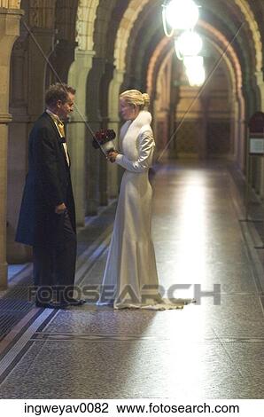 A young bride and groom in the hallway of a church View Large Photo Image Stock Image - A young bride and groom in the hallway of a church. Fotosearch