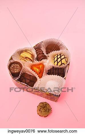 Close-up of a box of assorted chocolates View Large Photo Image Stock Photograph - Close-up of a box of assorted chocolates. Fotosearch