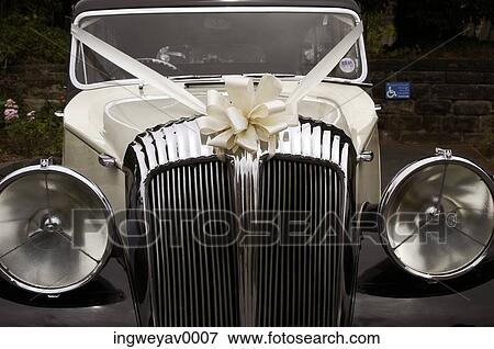 Close-up of a gift wrapped vintage car View Large Photo Image Stock Photo - Close-up of a gift wrapped vintage car. Fotosearch
