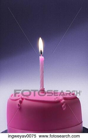 Close-up of a pink frosted cake with one lit candle View Large Photo Image Stock Photography - Close-up of a pink frosted cake with one lit candle. Fotosearch
