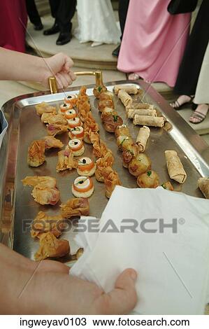 Close-up of a tray of hors d'oeuvres being served at a wedding reception View Large Photo Image Stock Image - Close-up of a tray of hors d'oeuvres being served at a wedding reception. Fotosearch