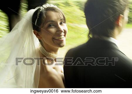 Close-up of a young bride and groom View Large Photo Image Stock Photograph - Close-up of a young bride and groom. Fotosearch