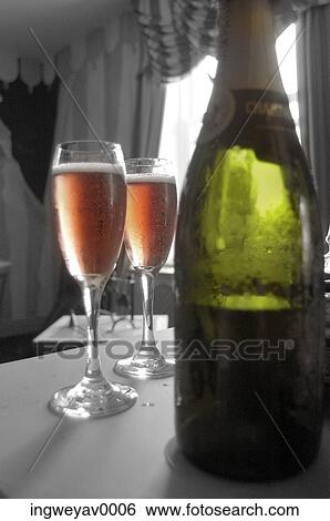 Close-up of champagne tulips beside a bottle of champagne View Large Photo Image Stock Photograph - Close-up of champagne tulips beside a bottle of champagne. Fotosearch