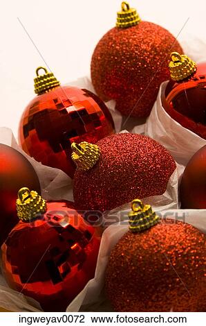 Close-up of red Christmas decorations View Large Photo Image Stock Image - Close-up of red Christmas decorations. Fotosearch