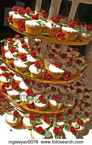 Close-up of rose cream tarts on a tiered plate holder View Large Photo Image Stock Photo - Close-up of rose cream tarts on a tiered plate holder. Fotosearch