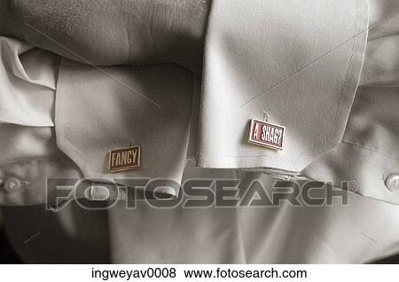 Close-up of the cufflinks on a shirt sleeve View Large Photo Image Stock Photo - Close-up of the cufflinks on a shirt sleeve. Fotosearch
