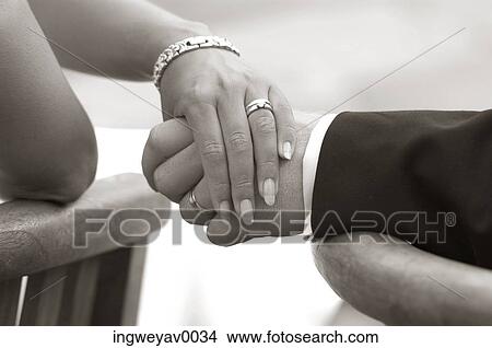 Close-up of the hands of a couple View Large Photo Image Picture - Close-up of the hands of a couple. Fotosearch