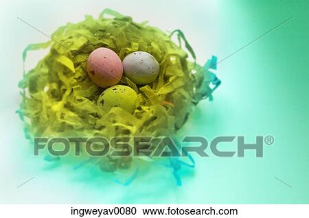 Close-up of three Easter eggs in a nest View Large Photo Image Stock Image - Close-up of three Easter eggs in a nest. Fotosearch