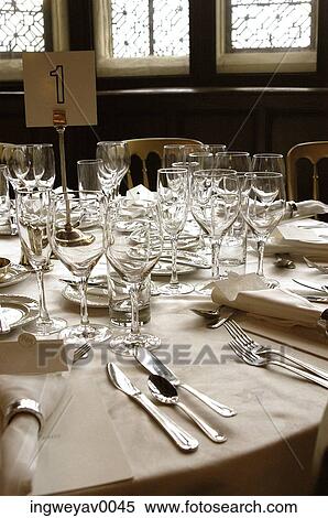 Display of glassware and cutlery on a dining table View Large Photo Image Stock Photography - Display of glassware and cutlery on a dining table. Fotosearch