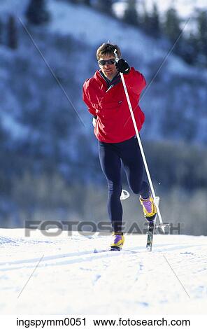 A man skiing a snowy mountain top View Large Photo Image Stock Image - A man skiing a snowy mountain top. Fotosearch