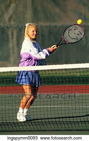 A teenage girl playing lawn tennis View Large Photo Image Stock Image - A teenage girl playing lawn tennis. Fotosearch