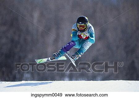 A young skier in midair during a ski run View Large Photo Image Stock Photo - A young skier in midair during a ski run. Fotosearch