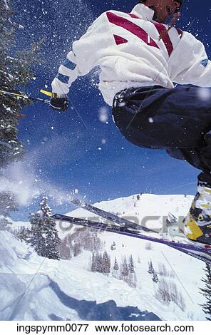 Close-up of a man skiing on a mountain View Large Photo Image Stock Photo - Close-up of a man skiing on a mountain. Fotosearch