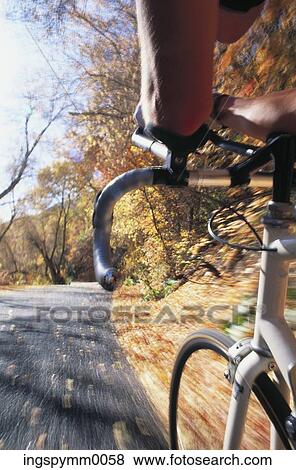 Close-up of the handlebars of a bicycle View Large Photo Image Stock Photo - Close-up of the handlebars of a bicycle. Fotosearch