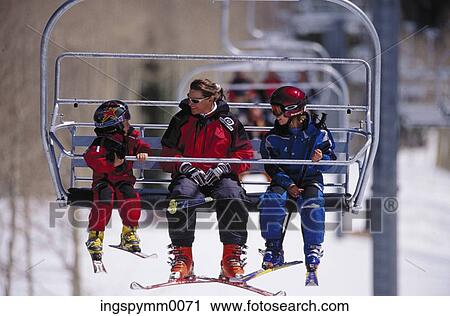 Couple with their daughter on a ski lift View Large Photo Image Stock Image - Couple with their daughter on a ski lift. Fotosearch