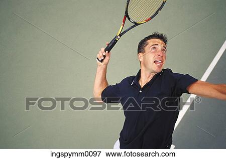 High angle view of a man playing tennis View Large Photo Image Stock Photo - High angle view of a man playing tennis. Fotosearch