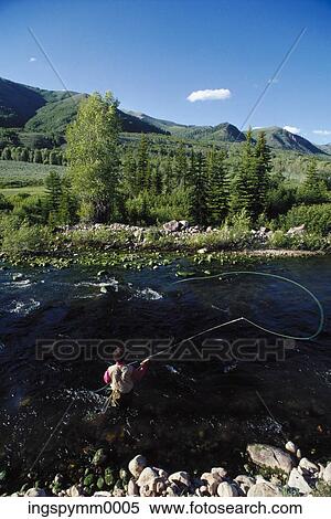 High angle view of a man throwing a fishing line into a stream View Large Photo Image Stock Photography - High angle view of a man throwing a fishing line into a stream. Fotosearch