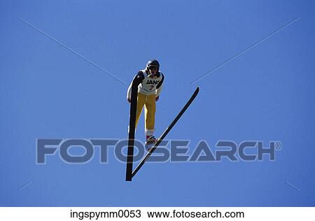 Low angle view of a skier jumping in midair View Large Photo Image Stock Image - Low angle view of a skier jumping in midair. Fotosearch