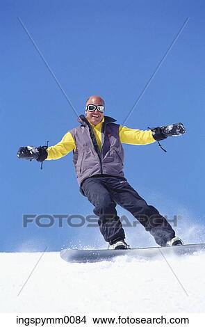 Man snow boarding on a mountain View Large Photo Image Picture - Man snow boarding on a mountain. Fotosearch