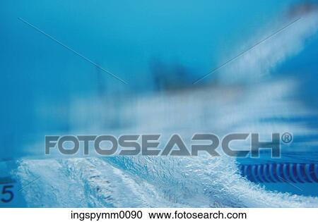 Underwater view of a swimmer diving into the water View Large Photo Image Stock Image - Underwater view of a swimmer diving into the water. Fotosearch