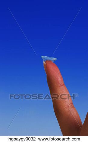Close-up of a contact lens on the tip of a person's finger View Large Photo Image Stock Image - Close-up of a contact lens on the tip of a person's finger. Fotosearch