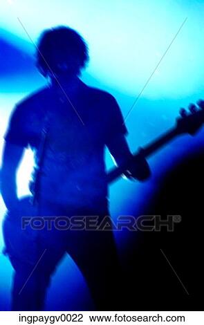 Close-up of a young man playing an electric guitar View Large Photo Image Stock Image - Close-up of a young man playing an electric guitar. Fotosearch