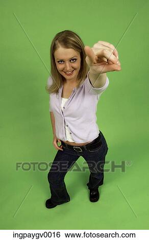 High angle view of a young woman smiling View Large Photo Image Stock Photograph - High angle view of a young woman smiling. Fotosearch