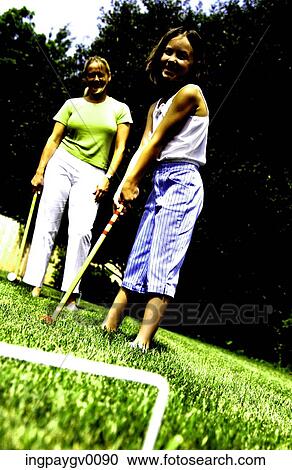 Mother and daughter playing croquet View Large Photo Image Stock Image - Mother and daughter playing croquet. Fotosearch