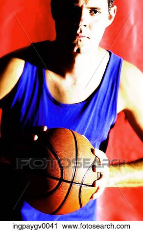 Portrait of a young male basketball player View Large Photo Image Stock Image - Portrait of a young male basketball player. Fotosearch
