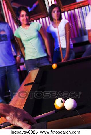 Two young woman standing at a snooker table View Large Photo Image Stock Photography - Two young woman standing at a snooker table. Fotosearch