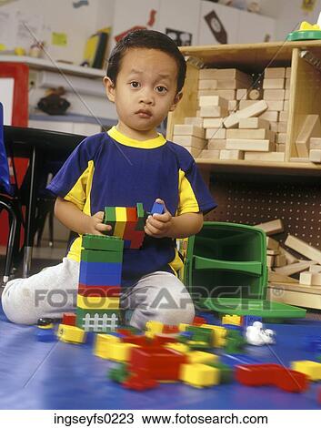 Asian American Boy Playing With Blocks And Looking Surprised View Large Photo Image Stock Image - Asian American Boy Playing With Blocks And Looking Surprised. Fotosearch
