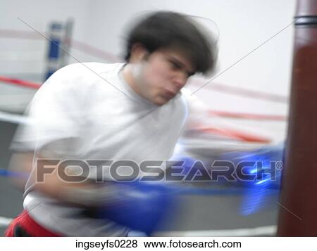 Boxer Punching Bag In Gym View Large Photo Image Stock Photo - Boxer Punching Bag In Gym. Fotosearch