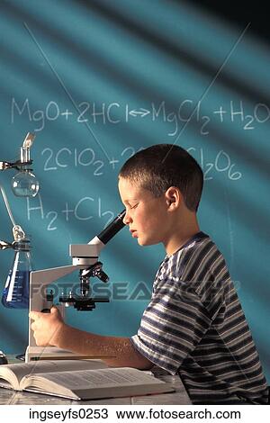 Boy Looking Into Microscope In Classroom View Large Photo Image Stock Image - Boy Looking Into Microscope In Classroom. Fotosearch
