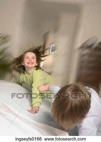Brother And Sister Wrestling In The Morning View Large Photo Image Stock Photograph - Brother And Sister Wrestling In The Morning. Fotosearch