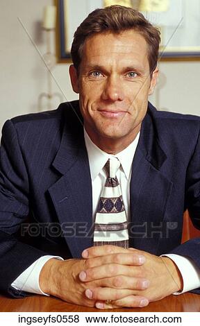 Stock Photo - Businessman Sitting at Desk. Fotosearch