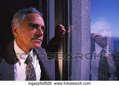 Businessman Staring out the Window View Large Photo Image Stock Photograph - Businessman Staring out the Window. Fotosearch
