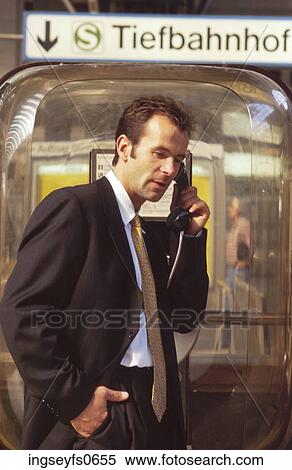 Businessman Using a Phone Booth View Large Photo Image Stock Photography - Businessman Using a Phone Booth. Fotosearch