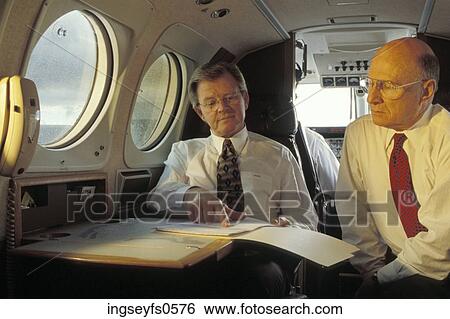 Businessmen on an Airplane View Large Photo Image Stock Photograph - Businessmen on an Airplane. Fotosearch