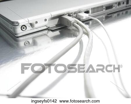 Stock Image - Cables Connecting to a Laptop Computer. Fotosearch