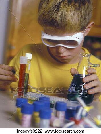 Caucasian Boy Doing Chemistry Experiment On Kitchen Table View Large Photo Image Stock Image - Caucasian Boy Doing Chemistry Experiment On Kitchen Table. Fotosearch