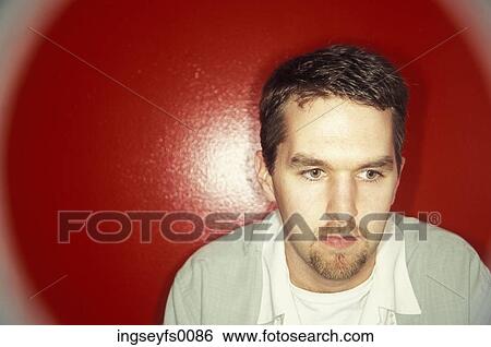 Caucasian Man With A Goatee Sitting In Front Of A Giant Red Dot View Large Photo Image Stock Photograph - Caucasian Man With A Goatee Sitting In Front Of A Giant Red Dot. Fotosearch