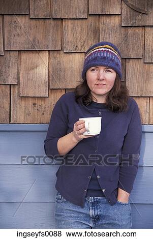 Caucasian Woman Drinking Coffee On A Cabin Porch View Large Photo Image Stock Photo - Caucasian Woman Drinking Coffee On A Cabin Porch. Fotosearch