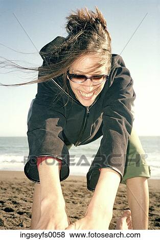Caucasian Woman Wanting You To Play On A Windy Beach With Her View Large Photo Image Stock Photo - Caucasian Woman Wanting You To Play On A Windy Beach With Her. Fotosearch