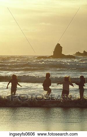 Children Playing in Waves View Large Photo Image Stock Photograph - Children Playing in Waves. Fotosearch