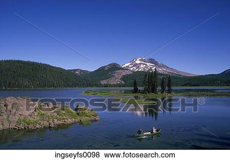 Couple Canoeing In A Mountain Lake View Large Photo Image Stock Photo - Couple Canoeing In A Mountain Lake. Fotosearch